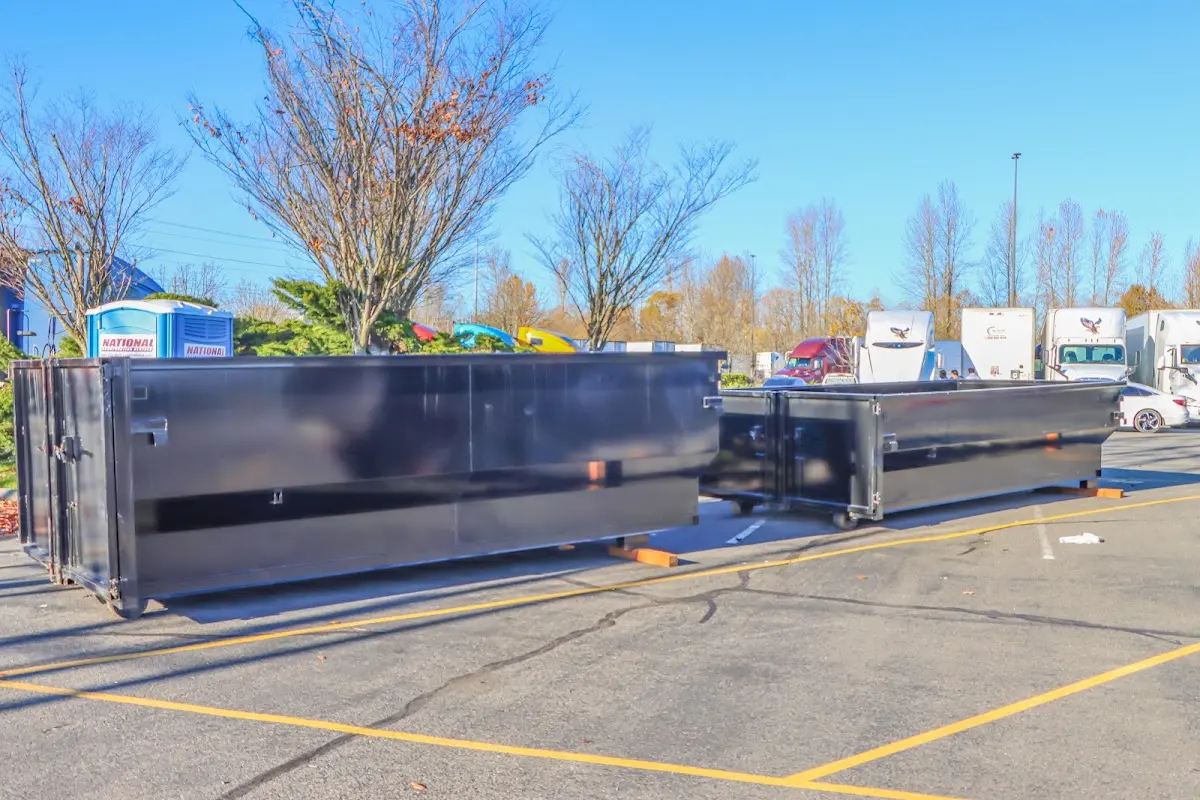 Professional dumpster rental service with roll-off container on residential driveway in Torrance